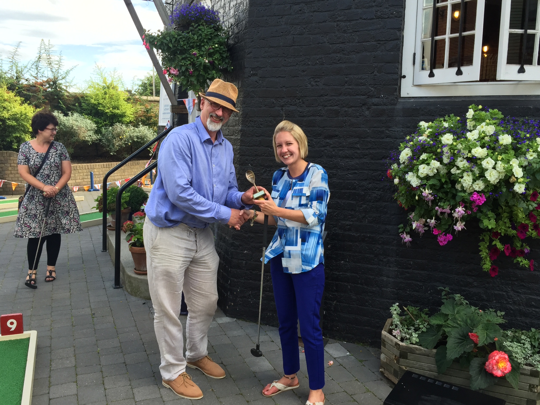 Andrew Nixon of Crazy Golf 4 U presenting Alice Thompson with her Wooden Spoon award for worst round on the day. 